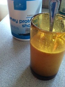 Activz Vanilla Whey powder in glass and can