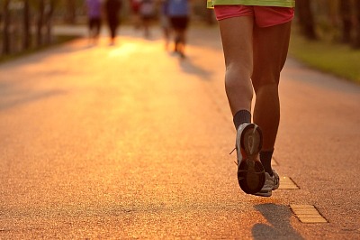 Feet Of Runner In Evening Light by Sura Nualpradid and freedigitalphotos