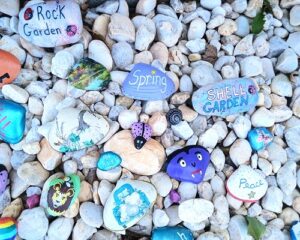 A Neighborhood Painted Rock and Seashell Garden