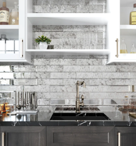 polished and beveled subway tiles in a kitchen backsplash.